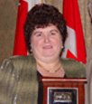 Glenda accepting her award