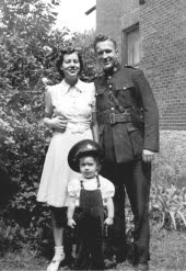 Officer Robert with his wife and son.