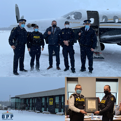 Officers in Moonsenee in front of an airplane