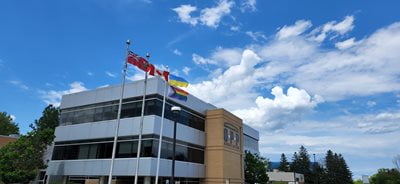 Progress Pride Flag flying at OPP Association Head Office in Barrie, Ontario June, 2022