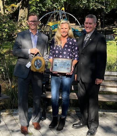 OPMF posing with plaque