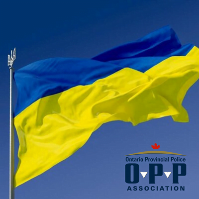 Ukraine flag with OPPA logo underneath in support