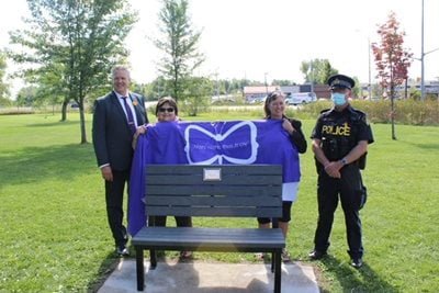 OPPA posing with a new bench and tree to promote suicide awareness
