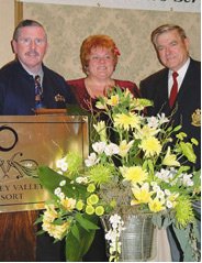 Faye and Brad accepting their awards